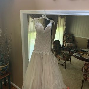 Brand new altered size 2 wedding gown.